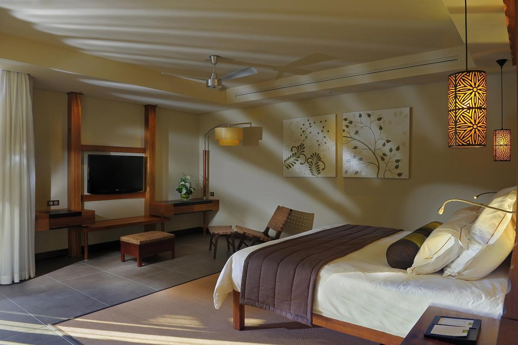 Trou Aux Biches Beachcomber Golf Resort & Spa Exterior photo A bedroom at the Taj Bengal