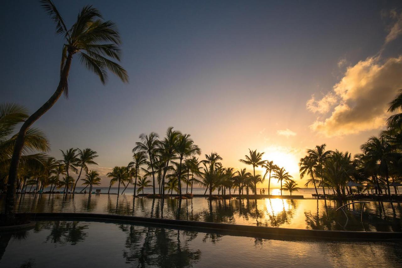 Trou Aux Biches Beachcomber Golf Resort & Spa Exterior photo Sunset at the Sheraton Waikiki