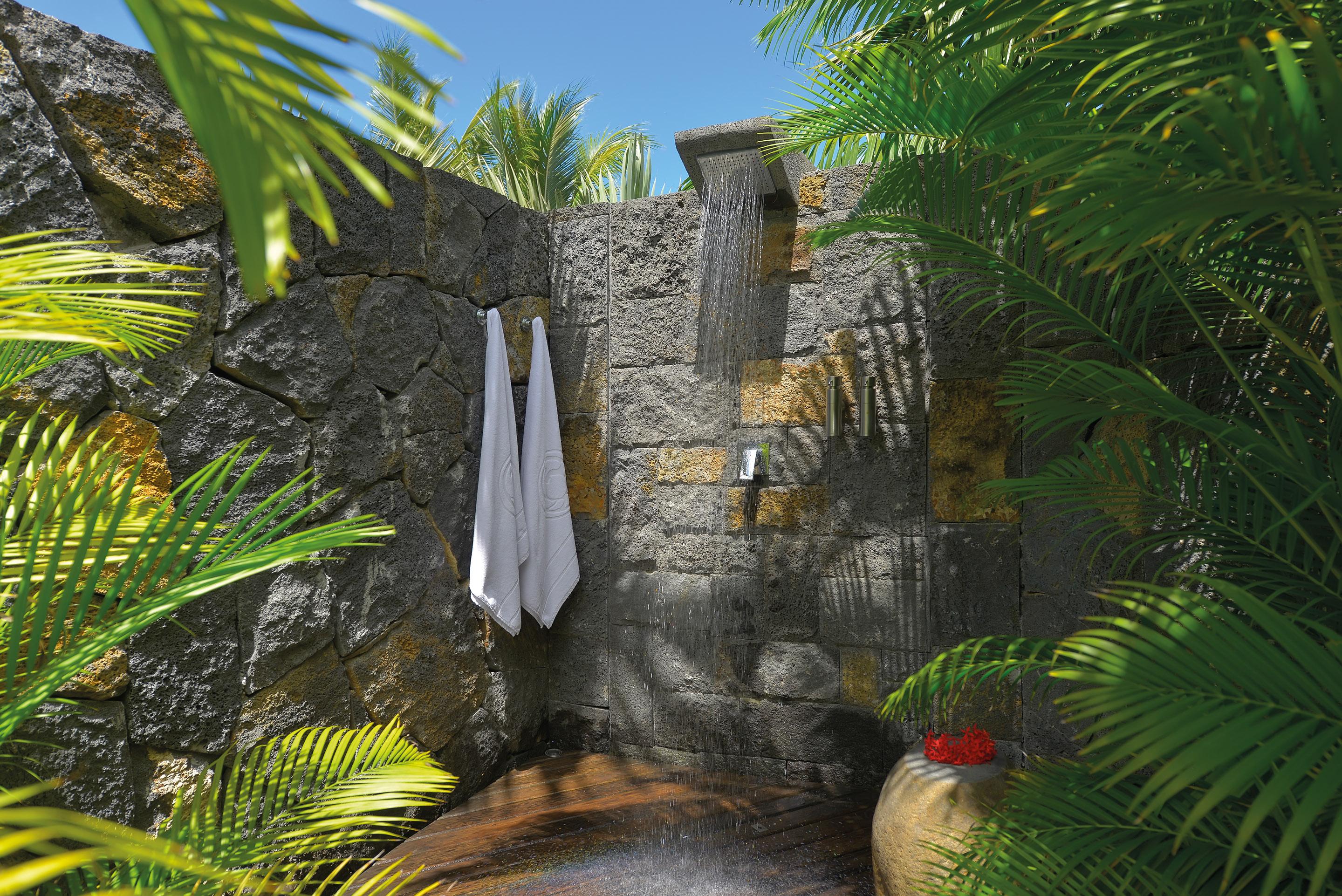 Trou Aux Biches Beachcomber Golf Resort & Spa Exterior photo A shower in a tropical garden