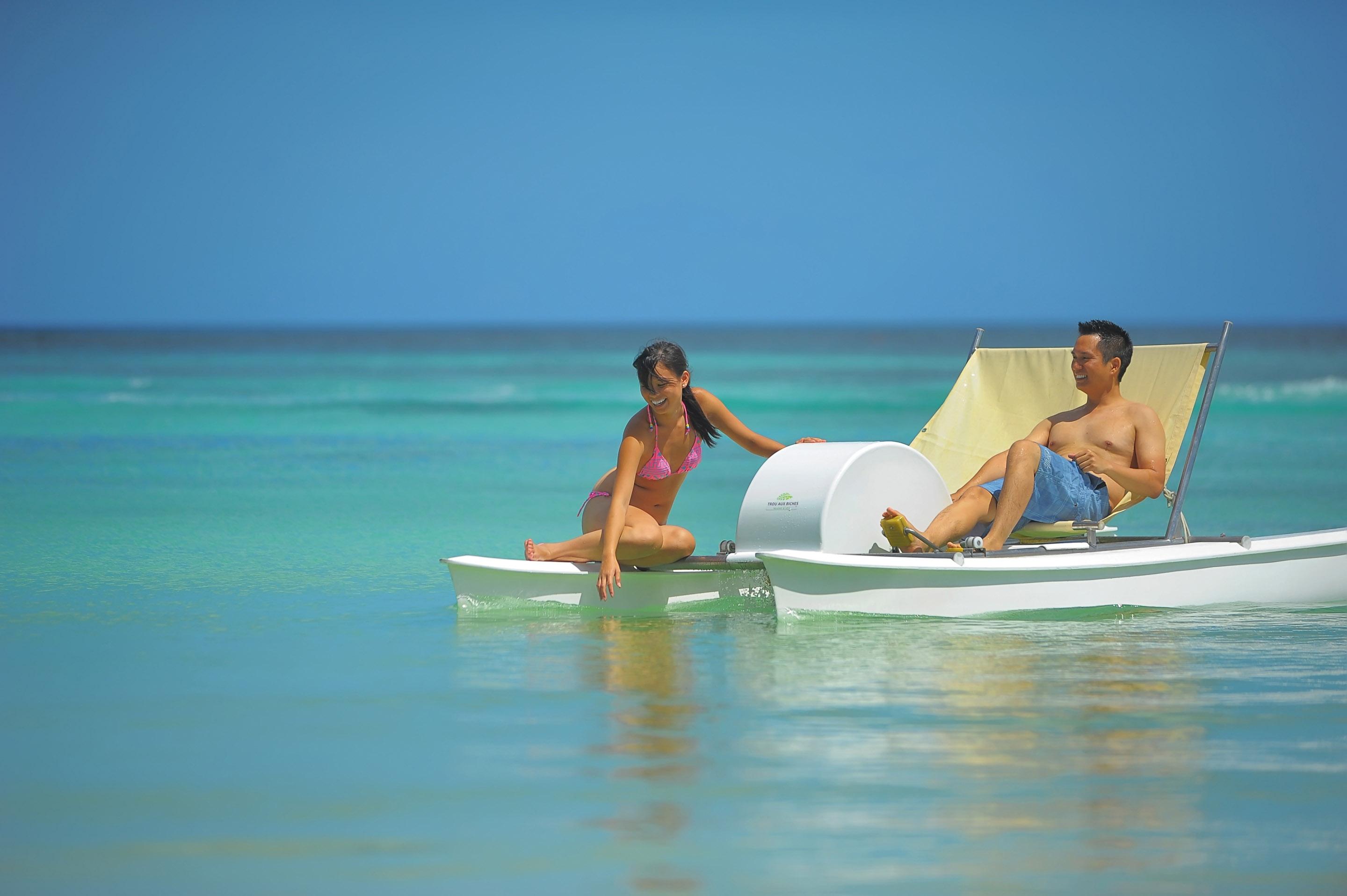 Trou Aux Biches Beachcomber Golf Resort & Spa Exterior photo A couple on a pedal boat